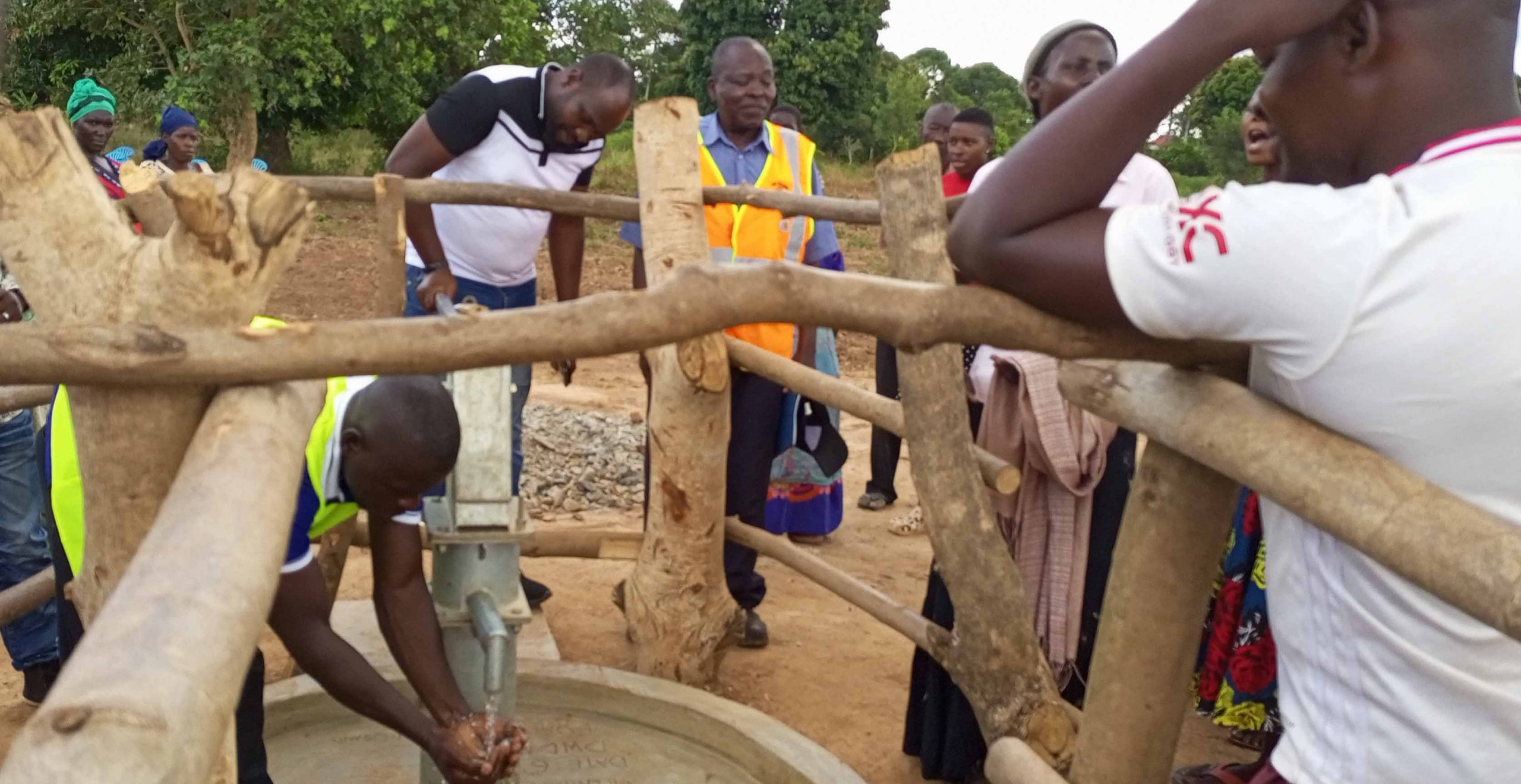 Prince Kitimbo Daniel Trying out the borehole
